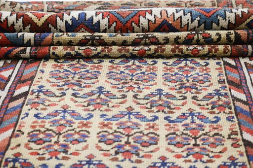 Close-up detail of 1900s Antique Carpets rug from Iran / Persia showing Wool weave