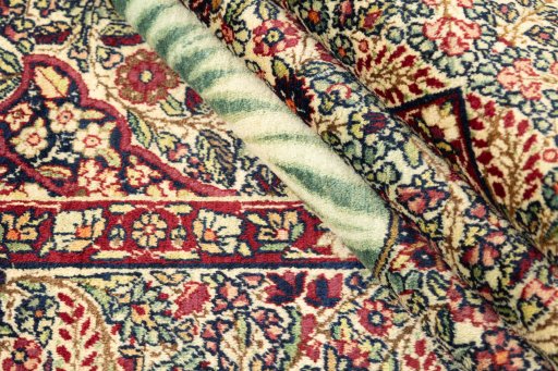 Close-up detail of 1900s Antique Carpets rug from Iran / Persia showing Wool weave