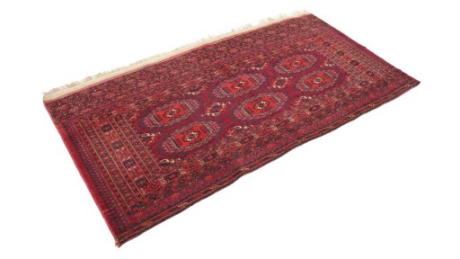 Close-up detail of 1900s Antique Carpets rug from Uzbekistan showing Wool weave