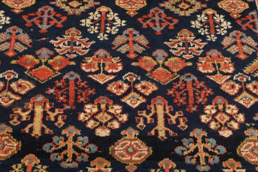Close-up detail of 1880s Antique Carpets rug from Iran / Persia showing Wool weave
