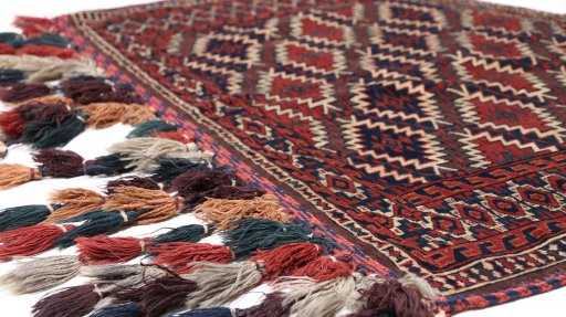 Central medallion detail of 1920s Antique Carpets rug from Uzbekistan