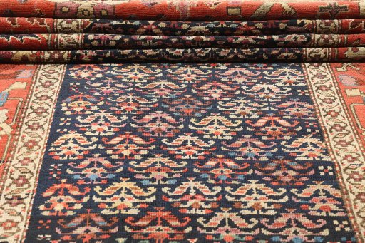 Close-up detail of 1880s Antique Carpets rug from Iran / Persia showing Wool weave