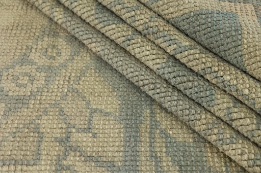 Corner detail of 1920s Antique Carpets rug showing border pattern and Wool pile