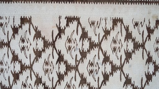 Corner detail of 1920s Kilim Antique rug showing border pattern and Wool pile