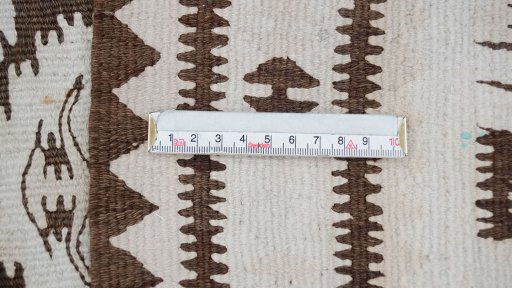 Surface texture of 1920s Kilim Antique rug with natural Wool and intricate pattern