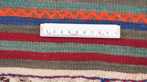 Close-up detail of New Kilim Antique rug from Iran / Persia showing Wool weave