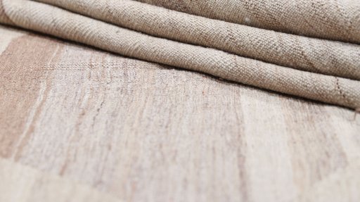 Close-up detail of New Kilim Antique rug from Iran / Persia showing Wool weave