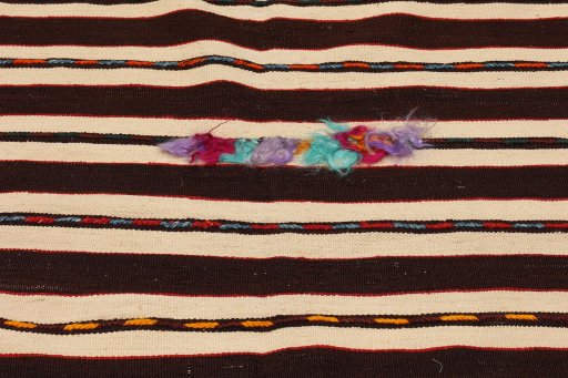Close-up detail of 1900s Kilim Antique rug from Turkey showing Wool weave