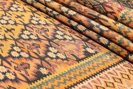 Close-up detail of 1920s Kilim Antique rug from Iran / Persia showing Wool weave