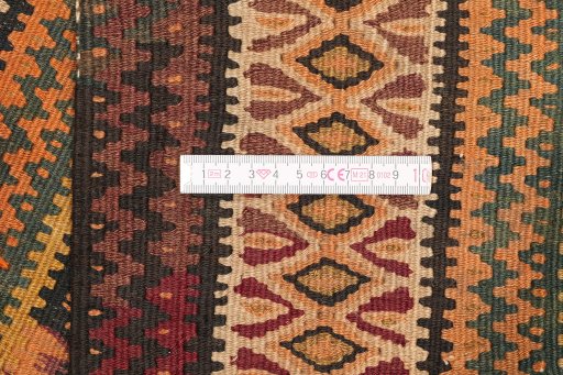 Full view of 1920s Kilim Antique rug from Iran / Persia, 419 × 109 cm in Brown tones