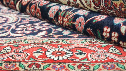 Close-up detail of 1950s Semi-antique Carpets rug from Iran / Persia showing Wool weave