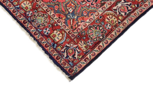 Backside of handmade 1950s Semi-antique Carpets rug showing knot structure and weave density