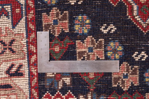Corner detail of 1955s Semi-antique Carpets rug showing border pattern and Wool pile