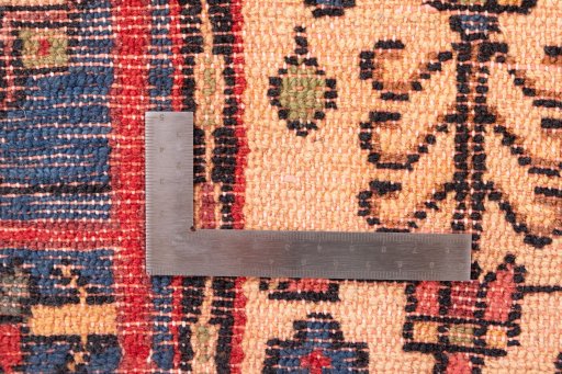 Corner detail of 1970s Semi-antique Carpets rug showing border pattern and Wool pile