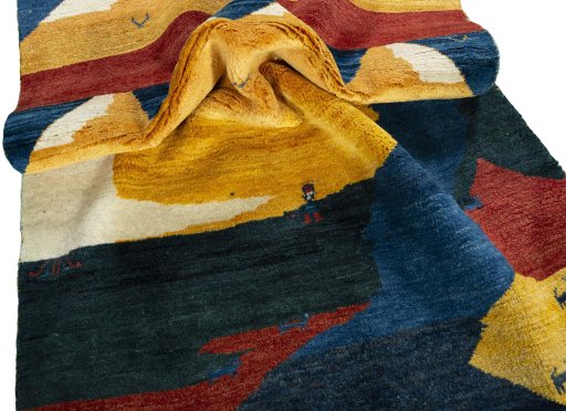 Corner detail of 2000s Persian Gabbeh rug showing border pattern and Wool pile