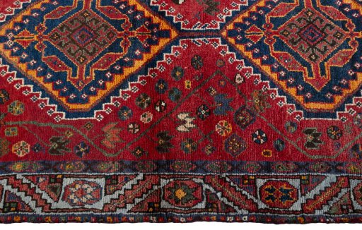 Close-up detail of 2000s Shiraz rug from Iran / Persia showing Wool weave