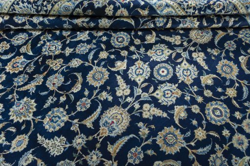 Close-up detail of 2000s Kashan rug from Iran / Persia showing Wool weave