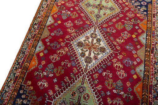 Backside of handmade 2000s Shiraz rug showing knot structure and weave density