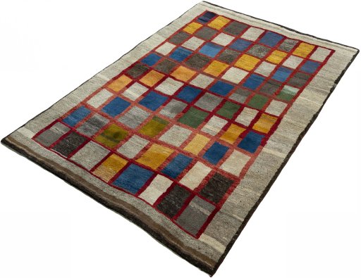 Corner detail of 2000s Persian Gabbeh rug showing border pattern and Wool pile
