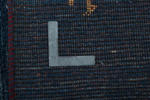 Corner detail of New Persian Gabbeh rug showing border pattern and Wool pile