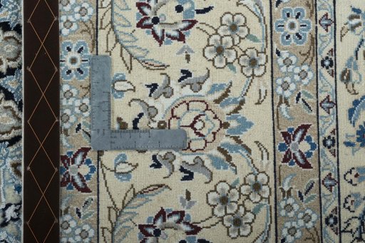 Backside of handmade 2000s Nain rug showing knot structure and weave density
