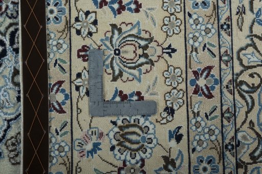 Backside of handmade 2000s Nain rug showing knot structure and weave density