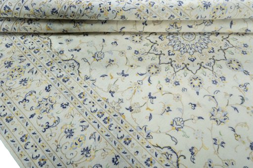 Corner detail of 2000s Kashan rug showing border pattern and Wool pile