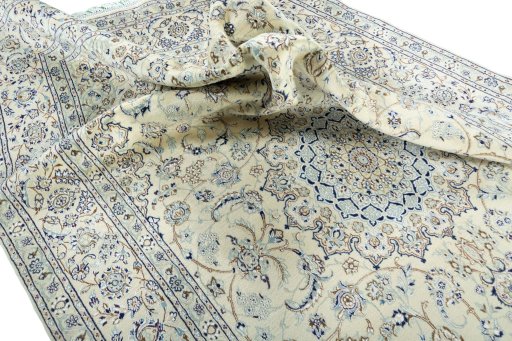 Surface texture of 2000s Nain rug with natural Wool and intricate pattern
