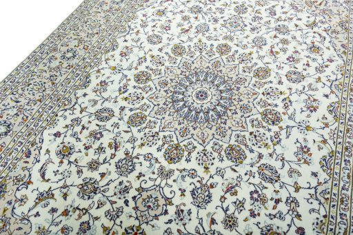 Backside of handmade 2000s Kashan rug showing knot structure and weave density