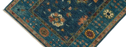 Backside of handmade New Farahan rug showing knot structure and weave density