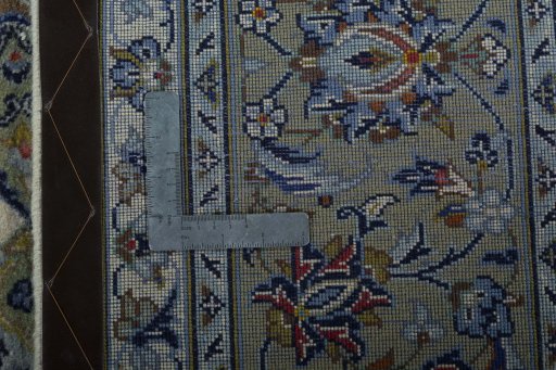 Backside of handmade 2000s Kashan rug showing knot structure and weave density