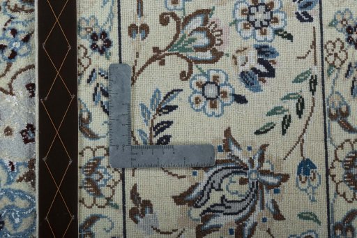 Backside of handmade 2000s Nain rug showing knot structure and weave density