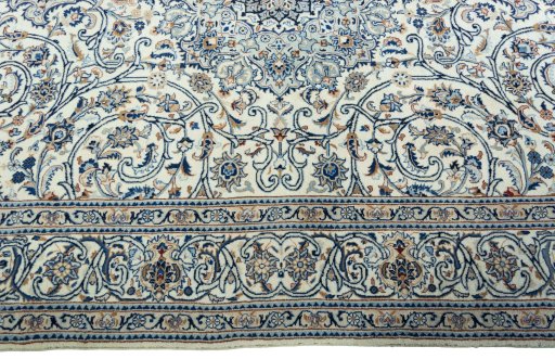 Corner detail of 2000s Kashmar rug showing border pattern and Wool pile