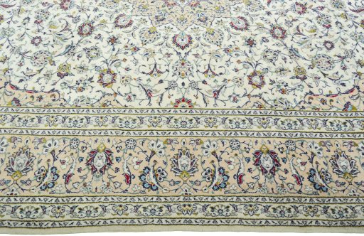 Corner detail of 2000s Kashan rug showing border pattern and Wool pile