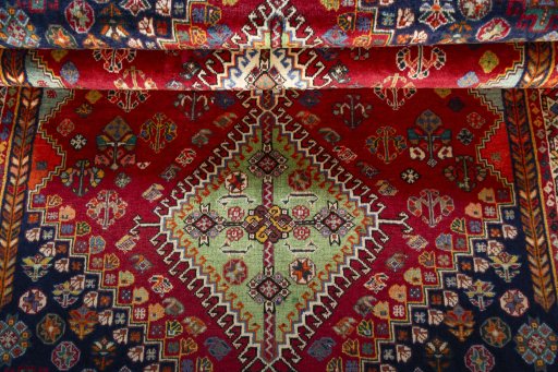 Full view of 2000s Shiraz rug from Iran / Persia, 175 × 110 cm in Red tones