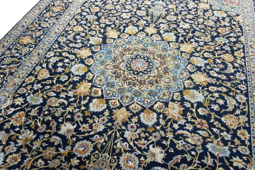 Backside of handmade 2000s Kashan rug showing knot structure and weave density
