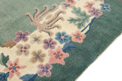 Backside of handmade 1940s China rug showing knot structure and weave density