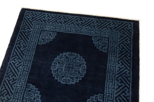 Surface texture of 1990s China rug with natural Wool and intricate pattern