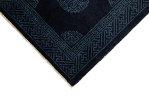 Backside of handmade 1990s China rug showing knot structure and weave density