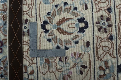 Backside of handmade New Nain rug showing knot structure and weave density