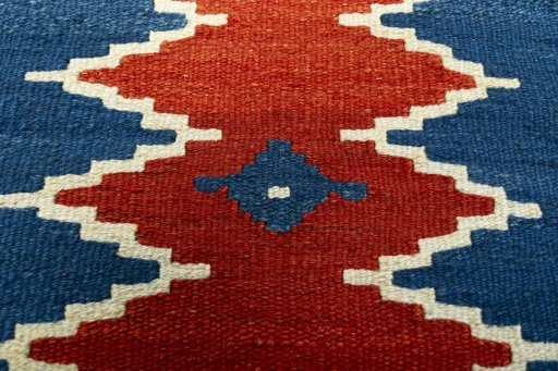 Backside of handmade New Modern Design rug showing knot structure and weave density
