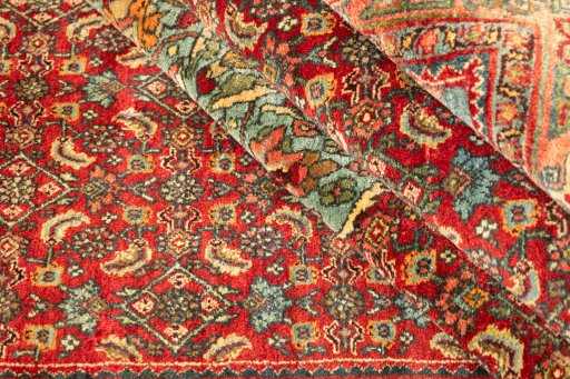 Corner detail of 1920s Bijar rug showing border pattern and Wool pile
