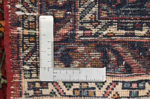 Corner detail of 1920s Bijar rug showing border pattern and Wool pile