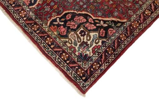 Backside of handmade 1920s Bijar rug showing knot structure and weave density