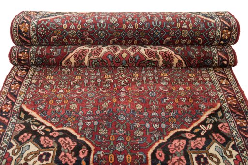 Full view of 1920s Bijar rug from Iran / Persia, 281 × 117 cm in Red tones