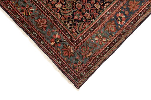 Backside of handmade 1920s Bijar rug showing knot structure and weave density
