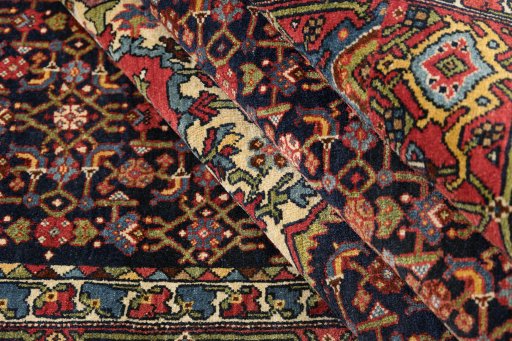 Corner detail of 1920s Bijar rug showing border pattern and Wool pile