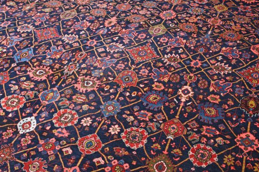 Corner detail of 1930s Bijar rug showing border pattern and Wool pile