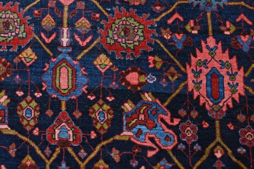 Backside of handmade 1930s Bijar rug showing knot structure and weave density