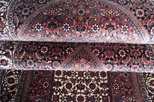 Full view of New Bijar rug from Iran / Persia, 405 × 76 cm in Red tones